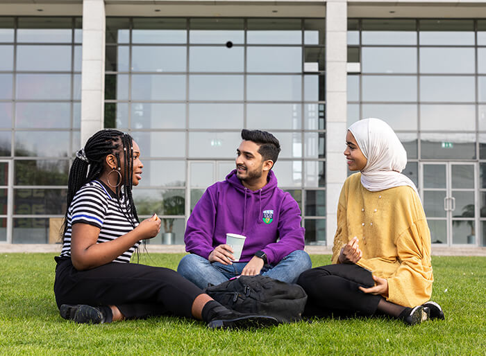 International students relaxing on the grounds of University College Dublin Study in Ireland